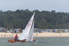 WSC GBR111 in front of huts