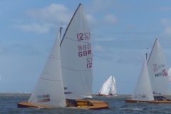 WSC GBR12 with sails catching light behind